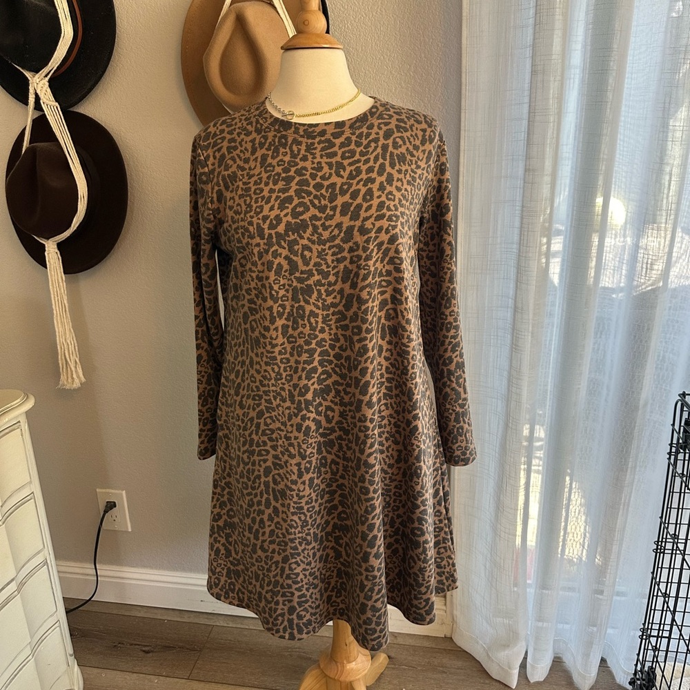 Animal print long sleeve dress with pockets size large.